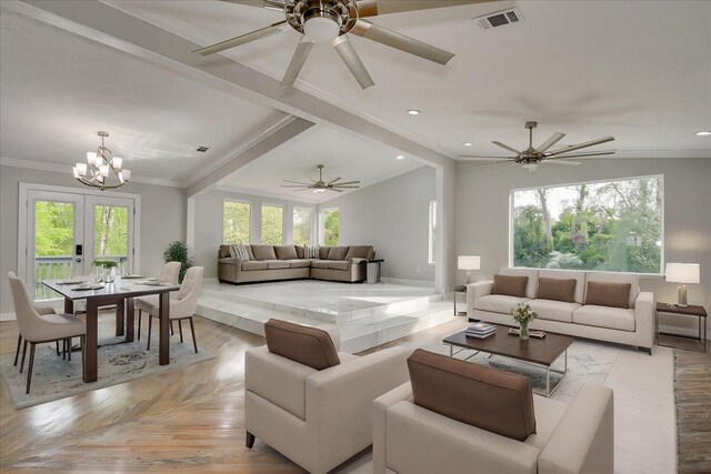 2417 Wilkshire Dr, Augusta, GA 30904 - living area featuring ceiling fan with notable chandelier, visible vents, crown molding, and vaulted ceiling with beams