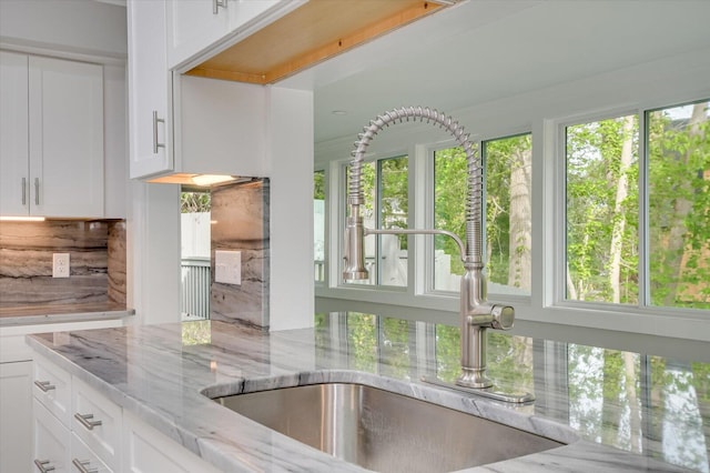 2417 Wilkshire Dr, Augusta, GA 30904 - kitchen with white cabinets, a sink, and light stone countertops