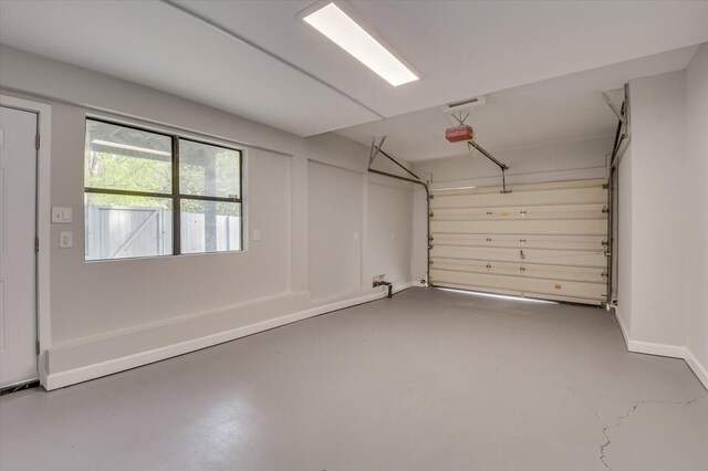 2417 Wilkshire Dr, Augusta, GA 30904 - garage with baseboards and a garage door opener