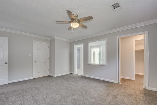 2417 Wilkshire Dr, Augusta, GA 30904 - interior space with visible vents, crown molding, ceiling fan, and carpet