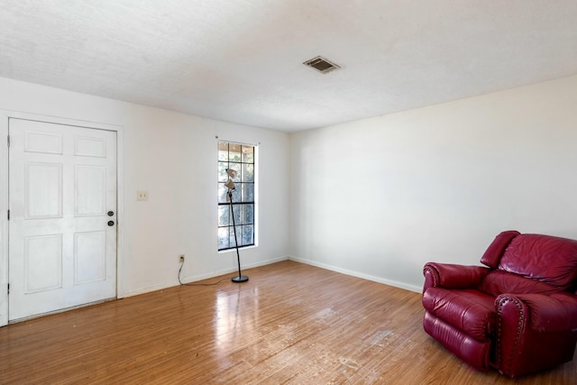 living area with wood-type flooring