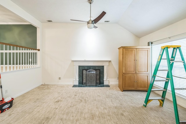 3758 Boulder Trl, Augusta, GA 30907 - unfurnished living room featuring ceiling fan, healthy amount of natural light, vaulted ceiling, a tile fireplace, and carpet