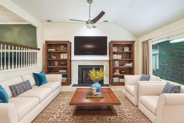 3758 Boulder Trl, Augusta, GA 30907 - living room featuring a ceiling fan, a glass covered fireplace, and vaulted ceiling