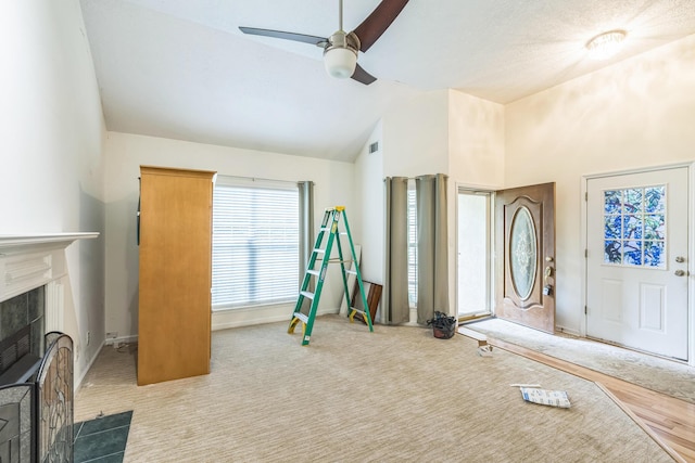 3758 Boulder Trl, Augusta, GA 30907 - exercise room featuring vaulted ceiling, ceiling fan, a tile fireplace, and carpet floors
