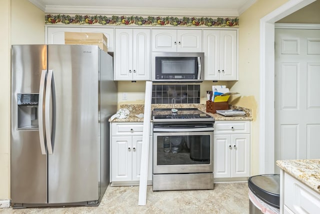 3758 Boulder Trl, Augusta, GA 30907 - kitchen featuring stainless steel appliances, light stone countertops, white cabinetry, and crown molding