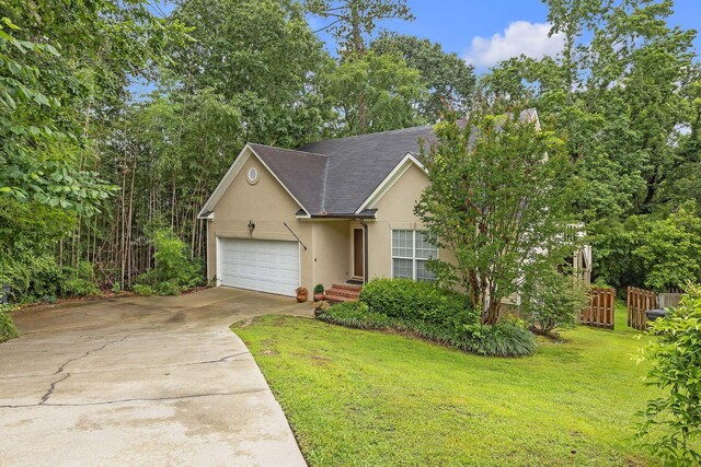 3758 Boulder Trl, Augusta, GA 30907 - view of front facade featuring stucco siding, concrete driveway, a garage, and roof with shingles