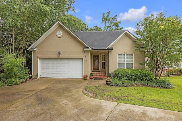 3758 Boulder Trl, Augusta, GA 30907 - view of front of house with stucco siding, a garage, driveway, a shingled roof, and a front yard