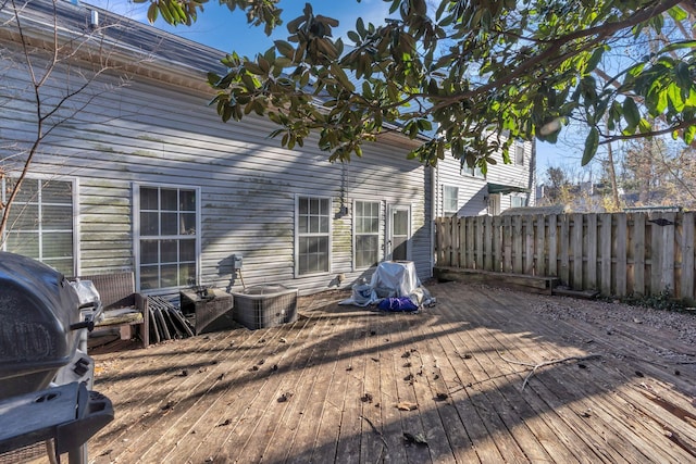 wooden terrace featuring a grill