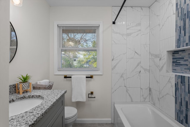 full bathroom featuring vanity, toilet, and tiled shower / bath