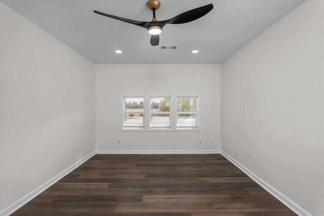 unfurnished room featuring dark hardwood / wood-style floors and ceiling fan