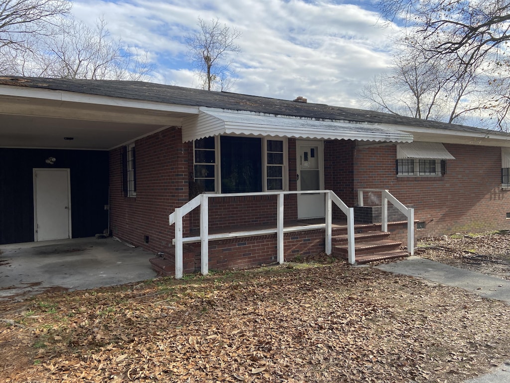 2008 Tubman Home Rd, Augusta, GA 30904 - view of front of property featuring brick siding, crawl space, and an attached carport