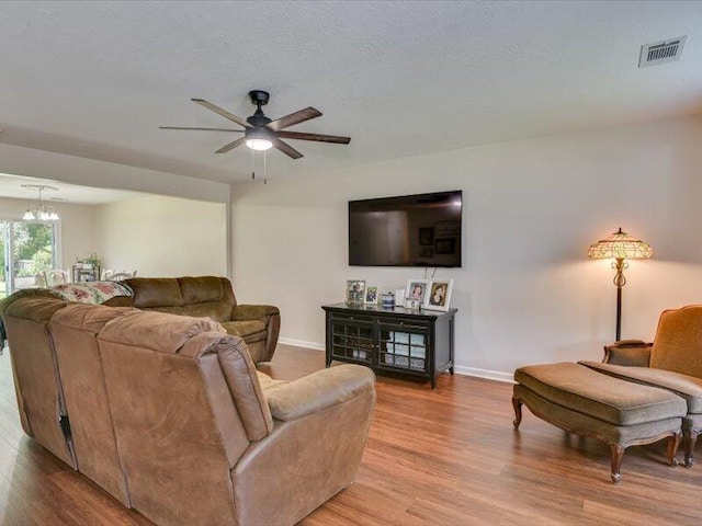 2084 Gardenview Dr, Graniteville, SC 29829 - living area with light wood-style floors, a chandelier, and a ceiling fan