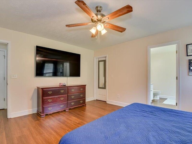 2084 Gardenview Dr, Graniteville, SC 29829 - bedroom with wood finished floors, ensuite bath, and ceiling fan
