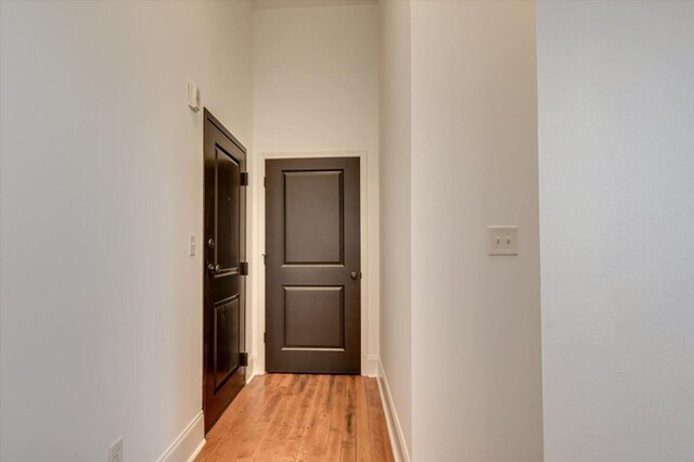 hall with light hardwood / wood-style flooring