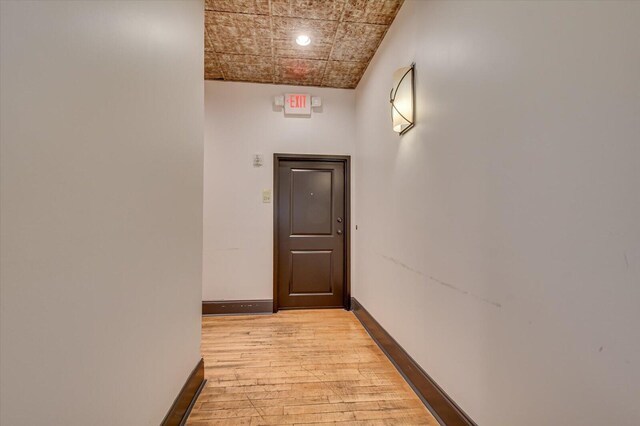 hall with light hardwood / wood-style floors