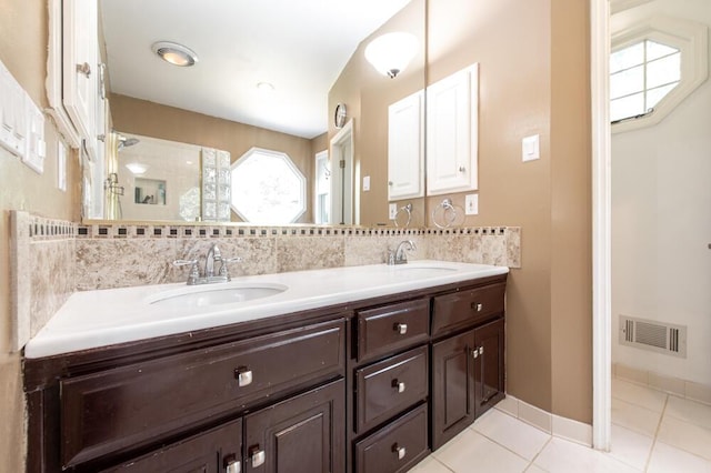 249 Calloway Dr, Evans, GA 30809 - bathroom with double vanity, tile patterned flooring, and a tile shower