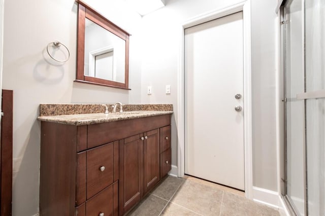 249 Calloway Dr, Evans, GA 30809 - bathroom featuring vanity, tile patterned floors, and a shower stall