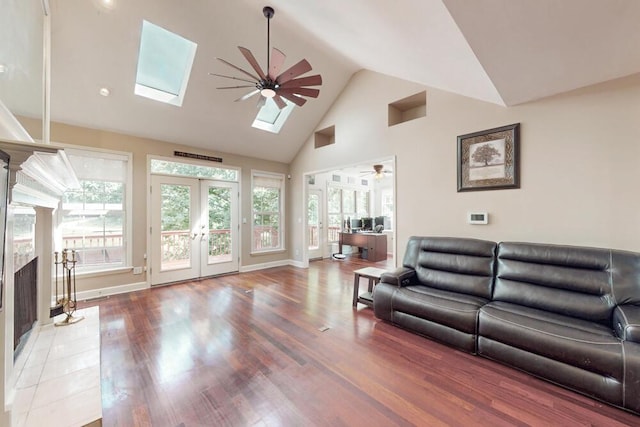 249 Calloway Dr, Evans, GA 30809 - living area featuring french doors, ceiling fan, a skylight, high vaulted ceiling, and wood finished floors