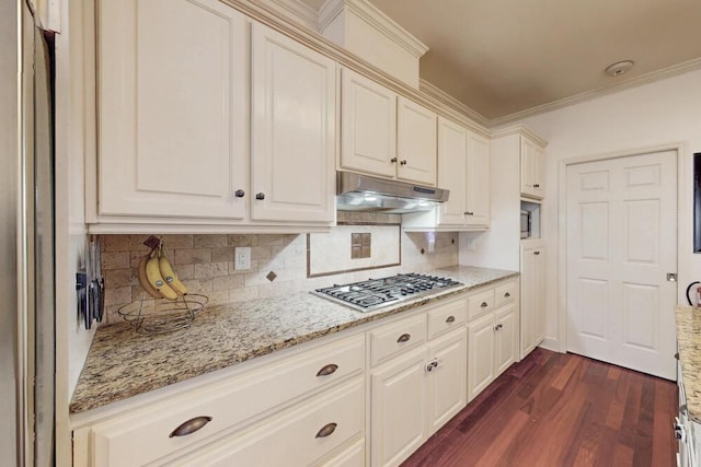 249 Calloway Dr, Evans, GA 30809 - kitchen featuring stainless steel gas cooktop, under cabinet range hood, dark wood finished floors, decorative backsplash, and light stone counters