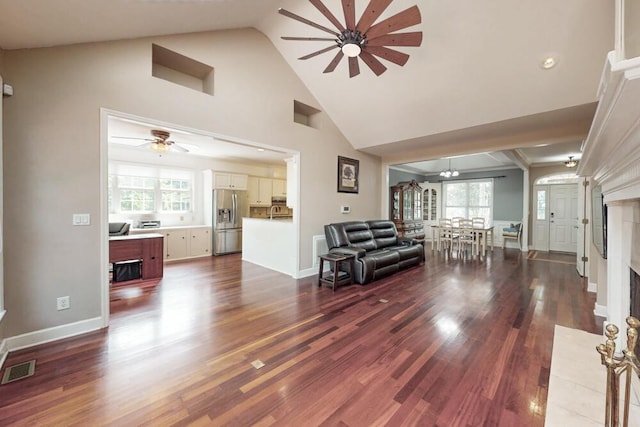249 Calloway Dr, Evans, GA 30809 - living area featuring a ceiling fan, dark wood finished floors, high vaulted ceiling, and a premium fireplace