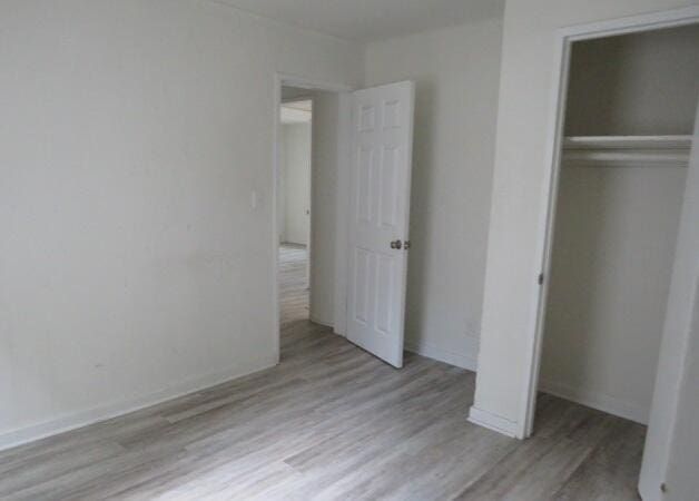 2320 Getzen St, Augusta, GA 30906 - unfurnished bedroom featuring wood finished floors and a closet