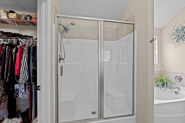1610 Cedar Hill Dr, Grovetown, GA 30813 - full bath featuring a shower stall, a garden tub, a walk in closet, and a textured ceiling
