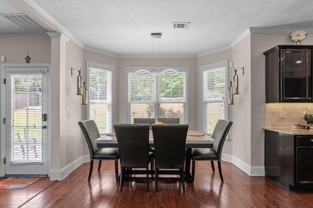1610 Cedar Hill Dr, Grovetown, GA 30813 - dining room featuring dark wood-type flooring, healthy amount of natural light, and ornamental molding