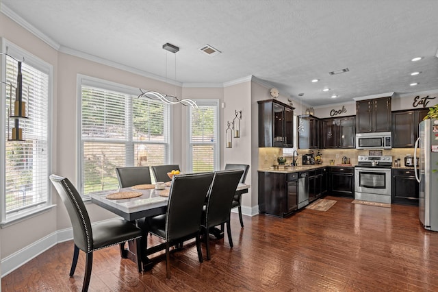 1610 Cedar Hill Dr, Grovetown, GA 30813 - dining space featuring dark wood-type flooring, recessed lighting, and ornamental molding