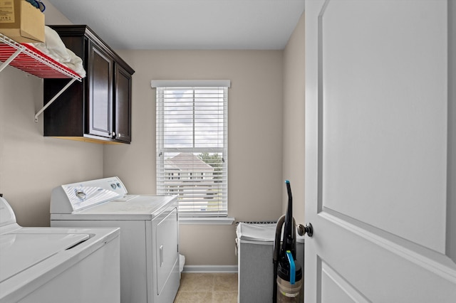 1610 Cedar Hill Dr, Grovetown, GA 30813 - laundry room featuring washing machine and dryer, cabinet space, plenty of natural light, and light tile patterned floors