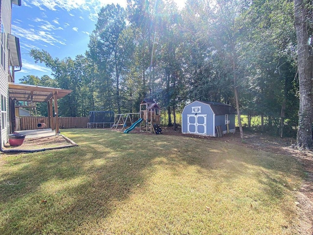 1410 Summit Way, Grovetown, GA 30813 - view of yard with a storage unit, a playground, and a trampoline