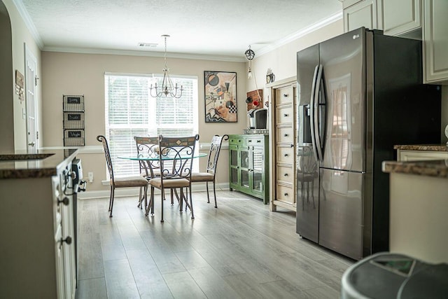 1410 Summit Way, Grovetown, GA 30813 - kitchen with stainless steel fridge, light wood finished floors, ornamental molding, a chandelier, and dark countertops