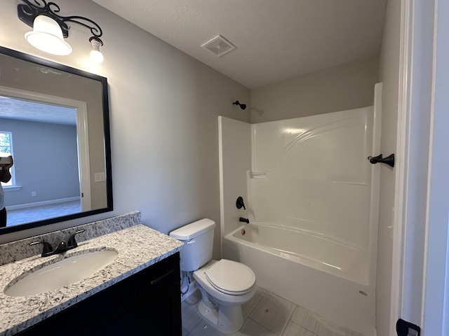 full bathroom with tile patterned floors, a textured ceiling,  shower combination, toilet, and vanity