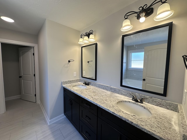 bathroom with tile patterned flooring and vanity