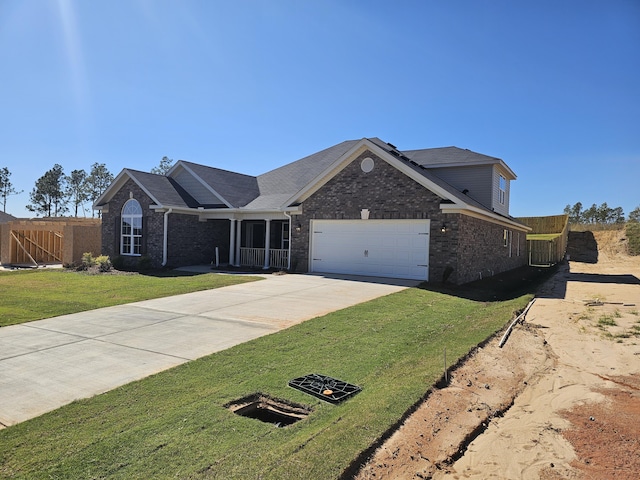 ranch-style house with a garage and a front yard