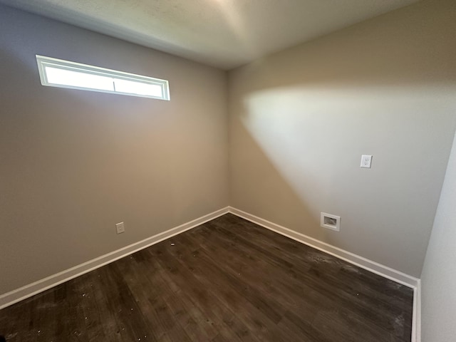 spare room featuring dark hardwood / wood-style floors