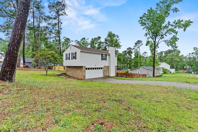 3758 Pine Ridge Run, Martinez, GA 30907 - view of side of home with driveway, an attached garage, and a chimney
