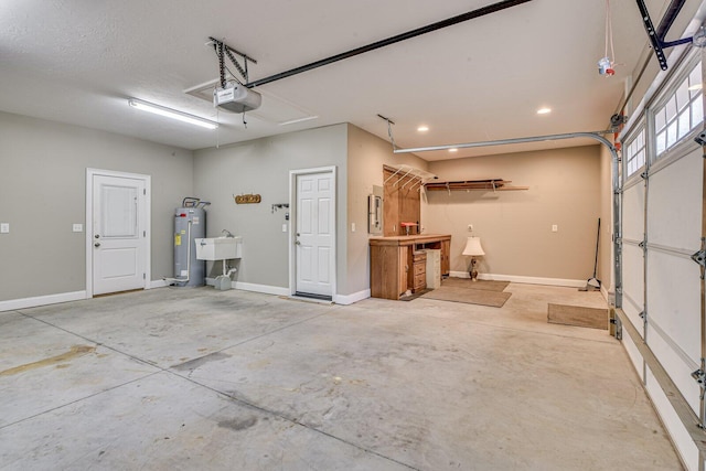 garage featuring water heater and a garage door opener