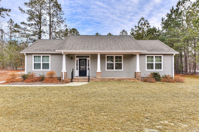 ranch-style home with a front lawn