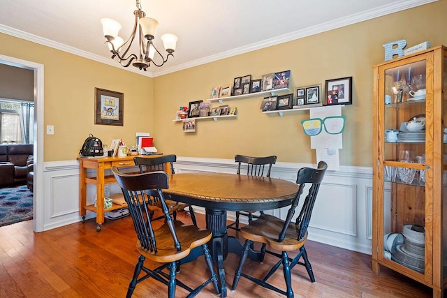 2009 Dundee Way, Grovetown, GA 30813 - dining area featuring wood finished floors, a chandelier, crown molding, wainscoting, and a decorative wall