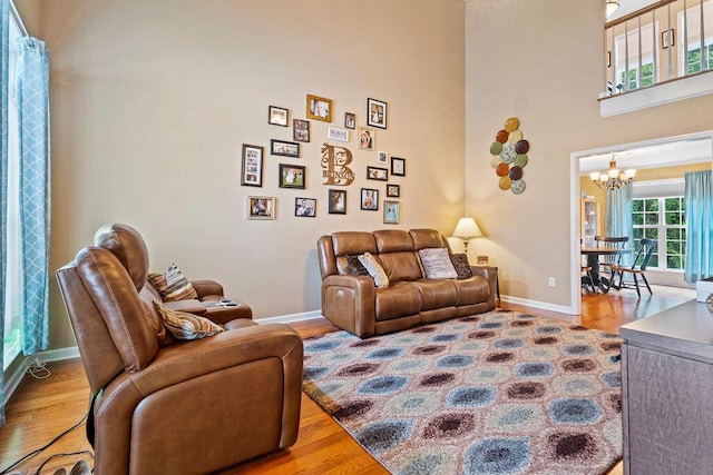2009 Dundee Way, Grovetown, GA 30813 - living area featuring a chandelier, wood finished floors, and a towering ceiling