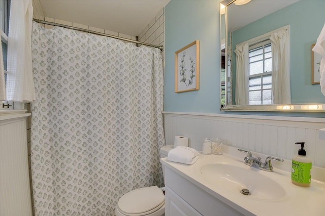 3122 Ramsgate Rd, Augusta, GA 30909 - bathroom with vanity, a wainscoted wall, and curtained shower