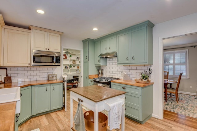 3122 Ramsgate Rd, Augusta, GA 30909 - kitchen with wood counters, green cabinetry, appliances with stainless steel finishes, and recessed lighting
