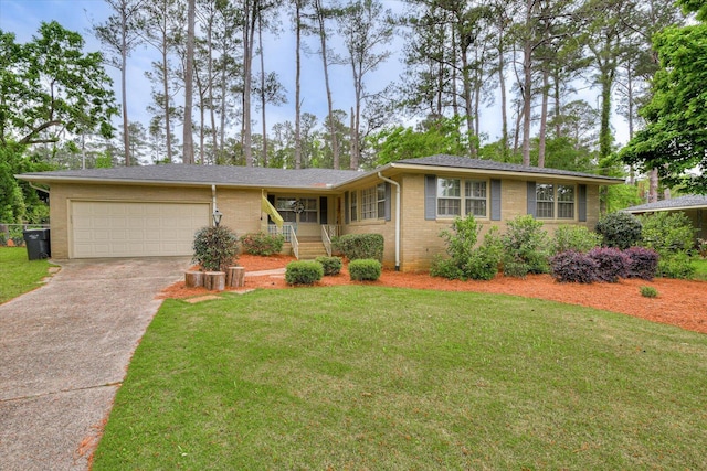 3122 Ramsgate Rd, Augusta, GA 30909 - ranch-style house with concrete driveway, brick siding, a garage, and a front yard