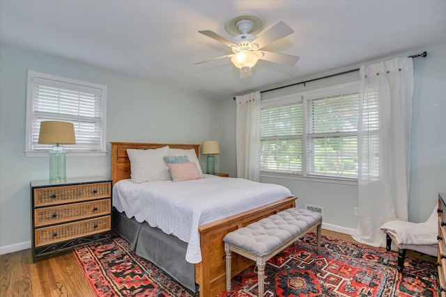 3122 Ramsgate Rd, Augusta, GA 30909 - bedroom featuring multiple windows, wood finished floors, and a ceiling fan