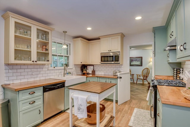 3122 Ramsgate Rd, Augusta, GA 30909 - kitchen featuring stainless steel appliances, wood counters, green cabinets, decorative backsplash, and recessed lighting
