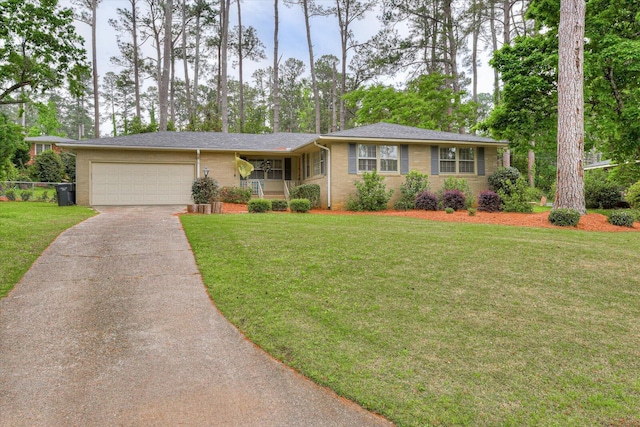 3122 Ramsgate Rd, Augusta, GA 30909 - single story home with concrete driveway, an attached garage, a front lawn, and brick siding