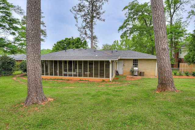 3122 Ramsgate Rd, Augusta, GA 30909 - rear view of house featuring a sunroom and roof with shingles