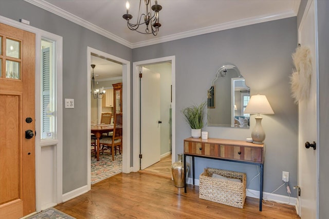 3122 Ramsgate Rd, Augusta, GA 30909 - entryway with a chandelier, ornamental molding, and wood finished floors