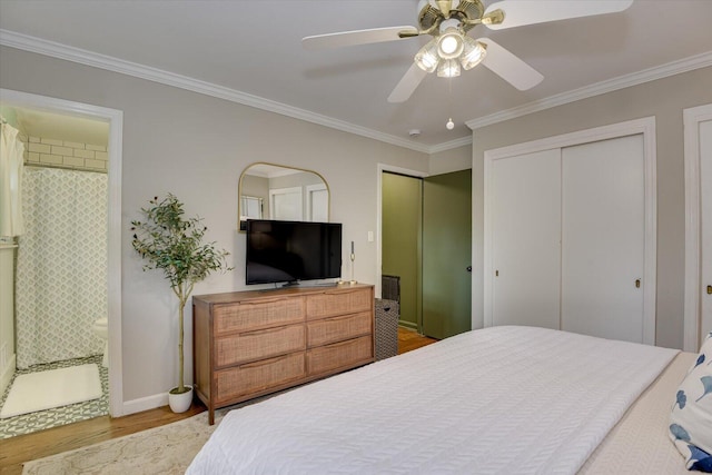 3122 Ramsgate Rd, Augusta, GA 30909 - bedroom with wood finished floors, crown molding, multiple closets, connected bathroom, and a ceiling fan