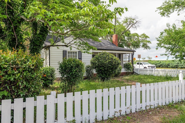 2638 Central Ave, Augusta, GA 30904 - view of front of house featuring a chimney, fence private yard, and roof with shingles